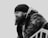 a black and white photo of a man with a beard