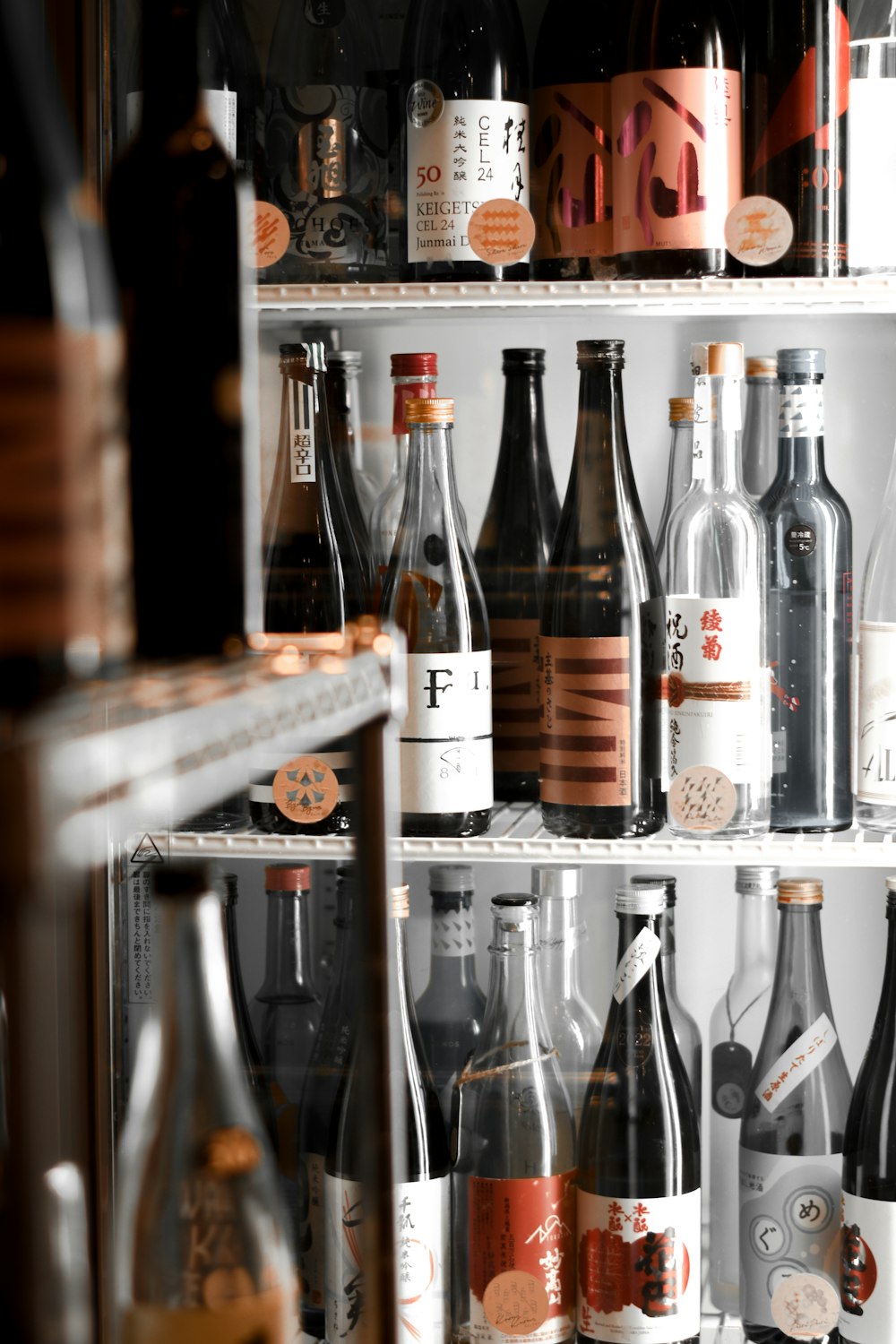 a refrigerator filled with lots of bottles of wine