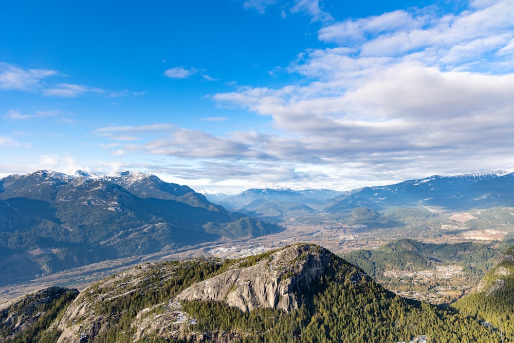 a view of a mountain range with a valley below