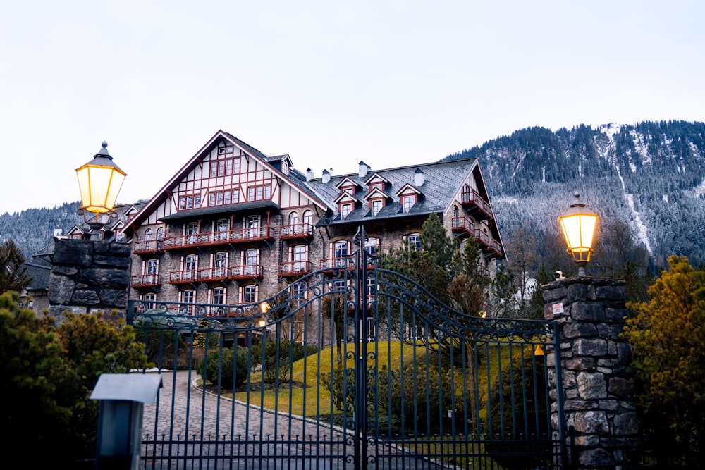 a large building with a gate and a light on top of it