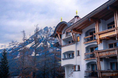 a building with a mountain in the background