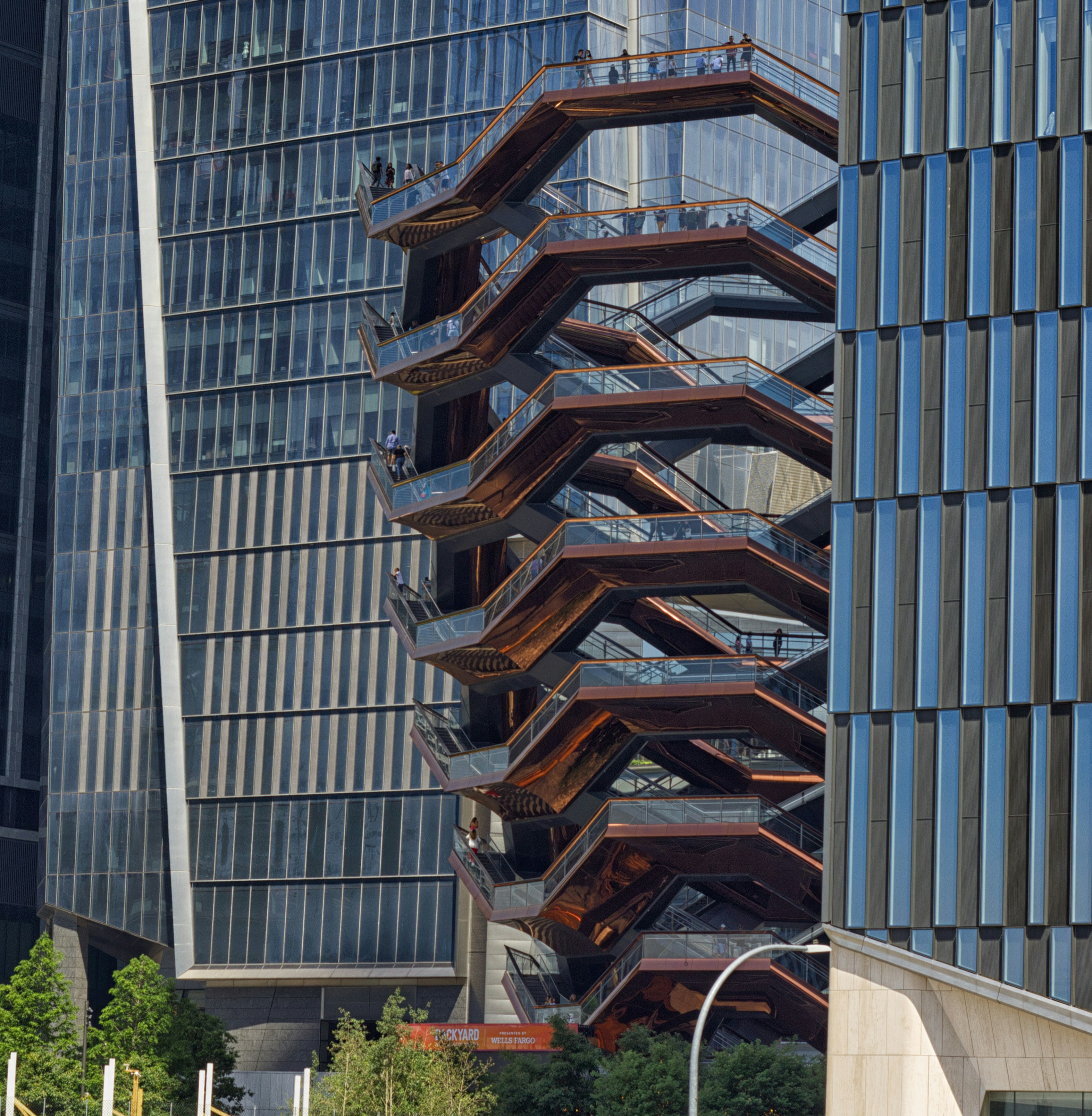 A tall building with a spiral staircase in front of it photo – Free New ...