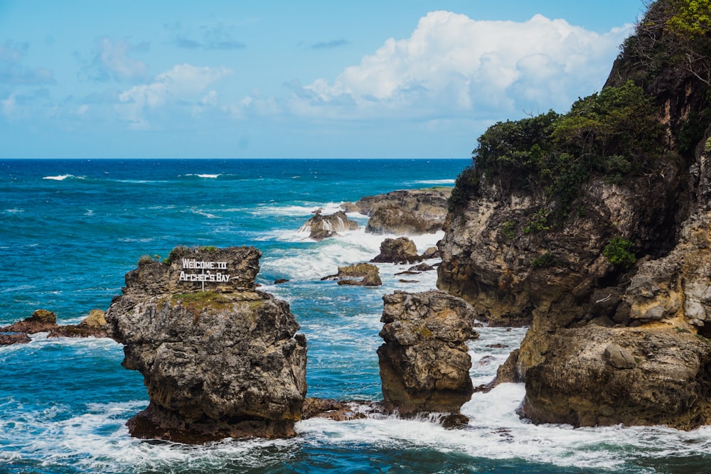 a view of the ocean from a rocky cliff