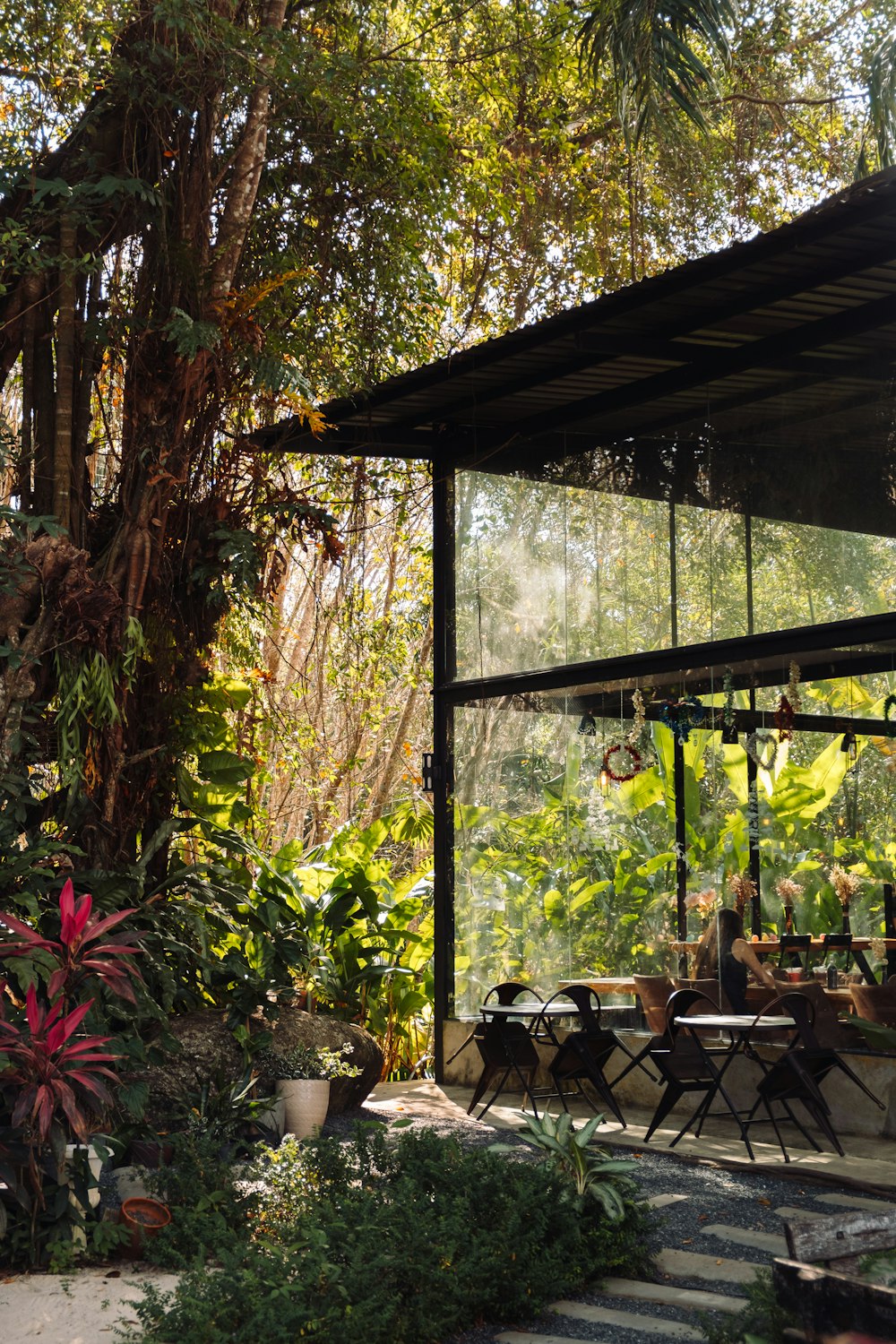 a patio with a table and chairs under a canopy