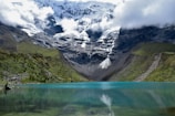 A serene alpine lake reflecting the surrounding peaks.