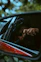 a man taking a picture of himself in a rear view mirror