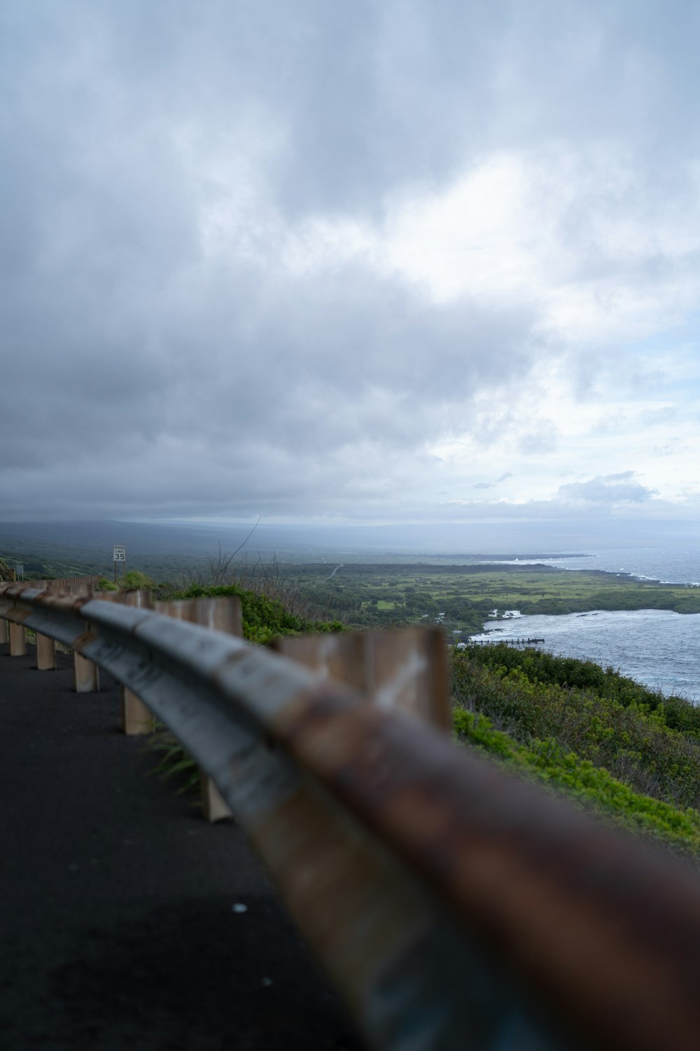 a view of the ocean from a bridge