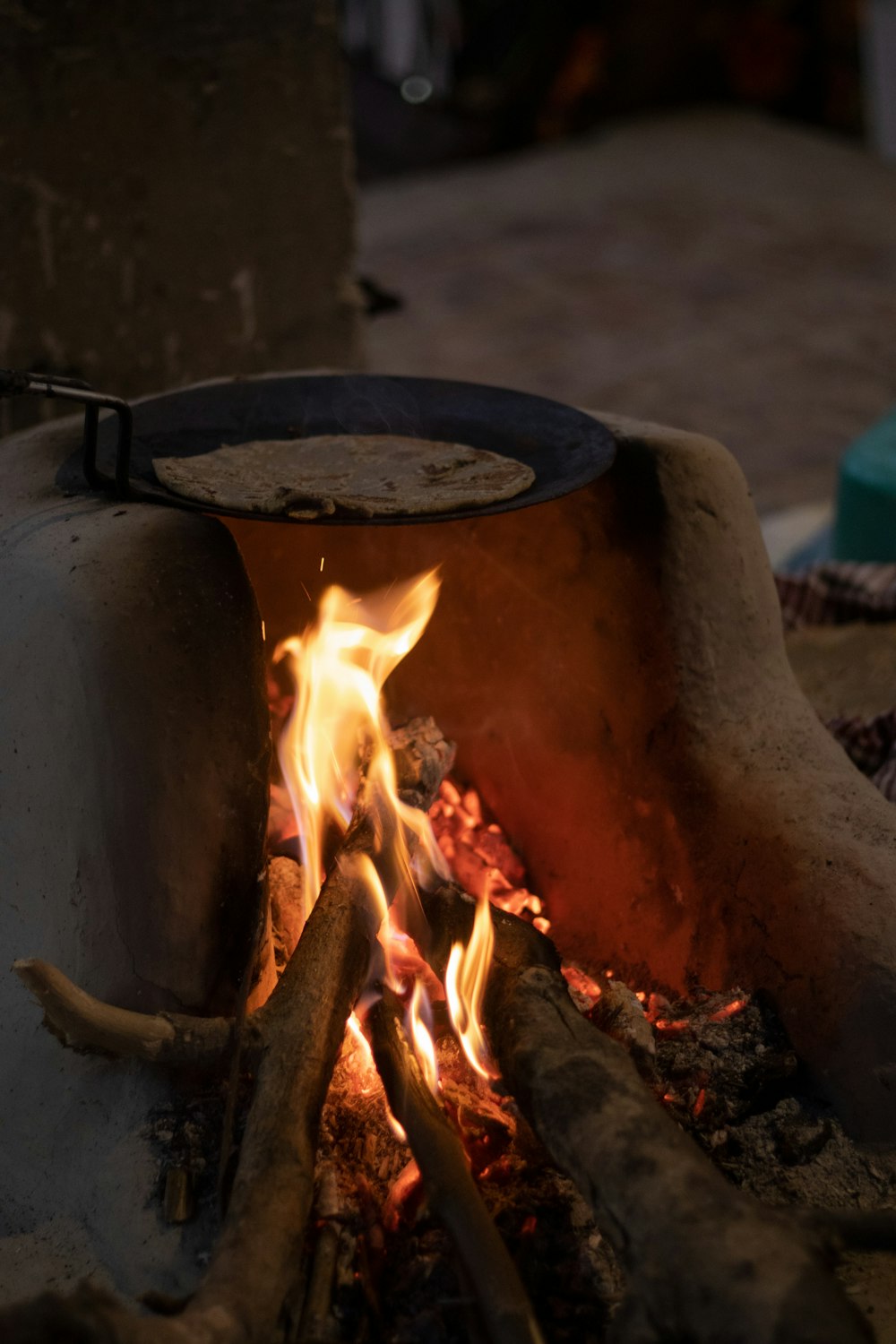 a close up of a fire burning in a brick oven