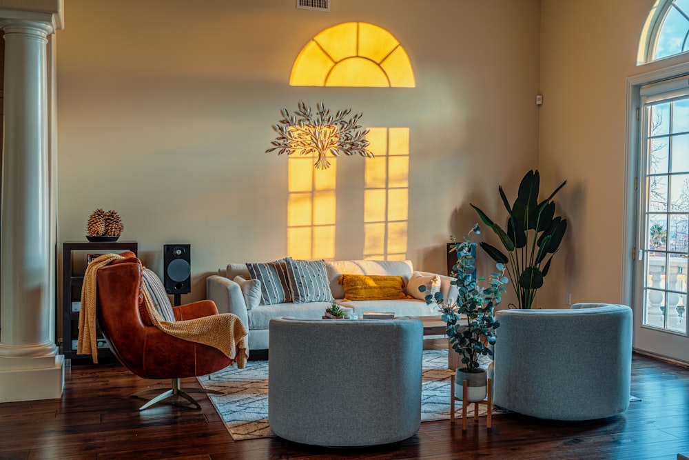 a living room filled with furniture and a large window