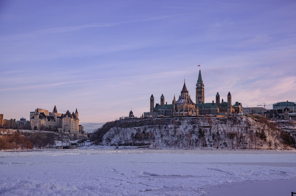 a castle on top of a hill in the snow