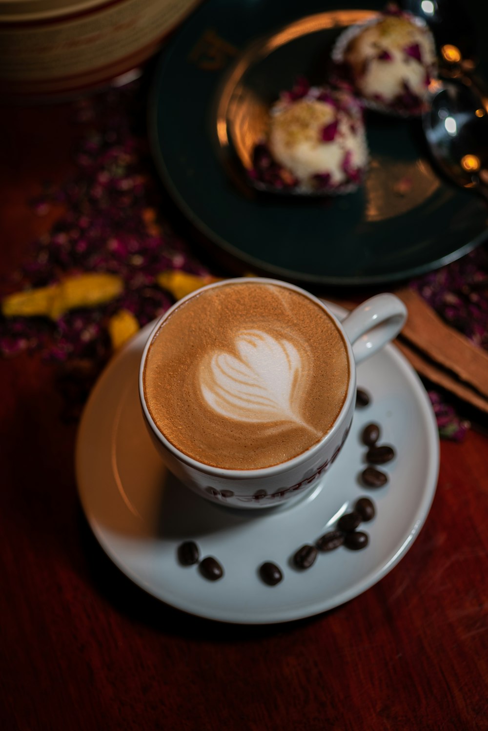 a cup of coffee on a saucer on a table