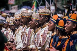 a group of men and women dressed in ethnic garb