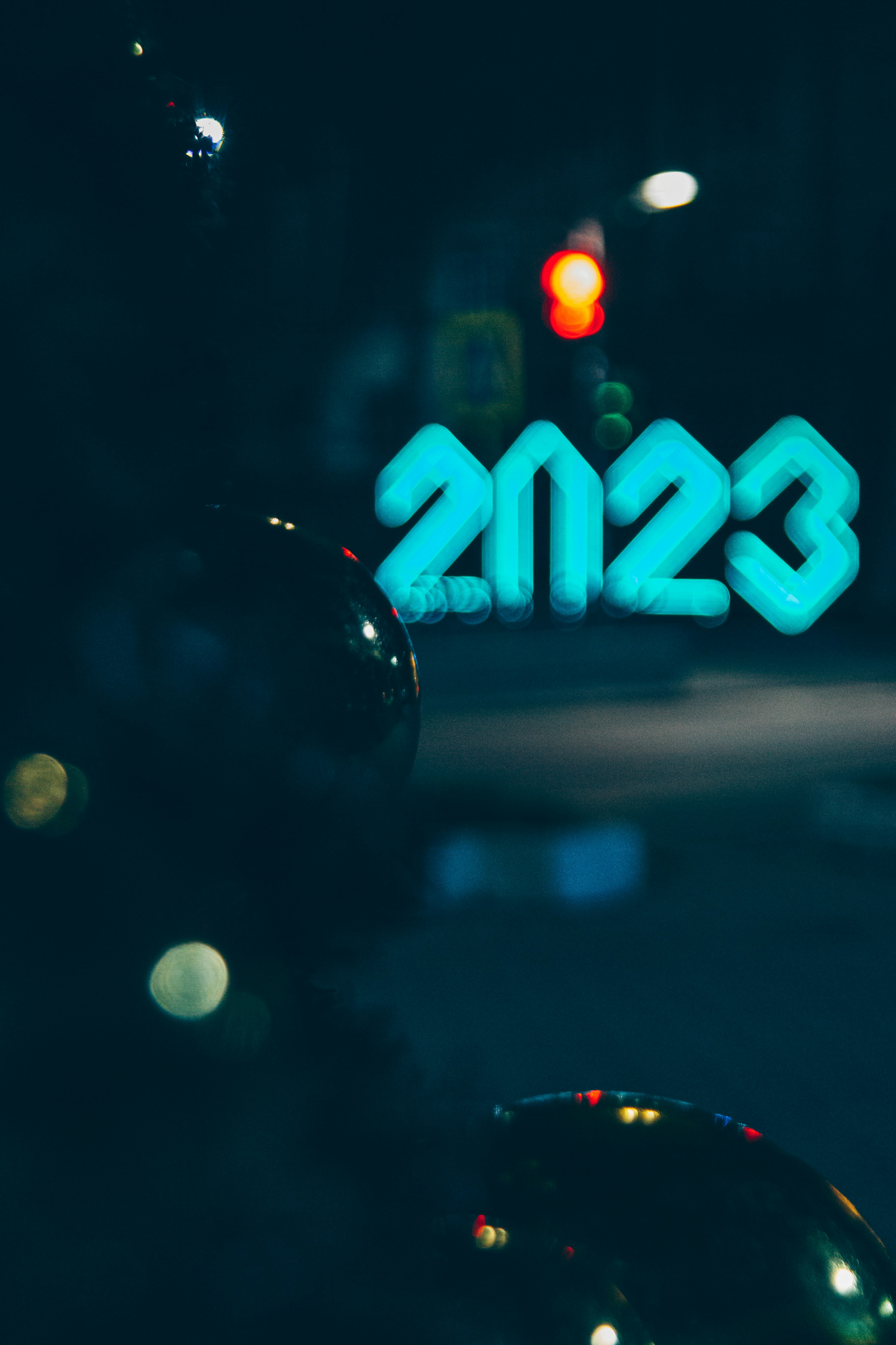 a blurry image of a street sign and a traffic light