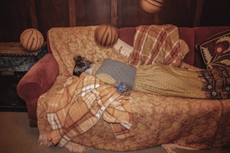 A user checking real-time basketball scores on a tablet in a cozy living room.