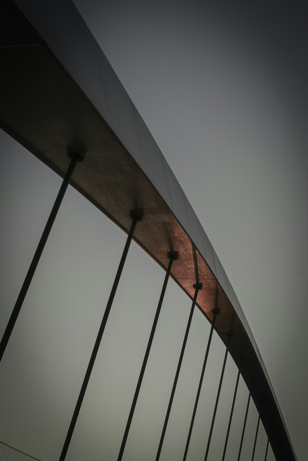 a bridge with a red light on the side of it