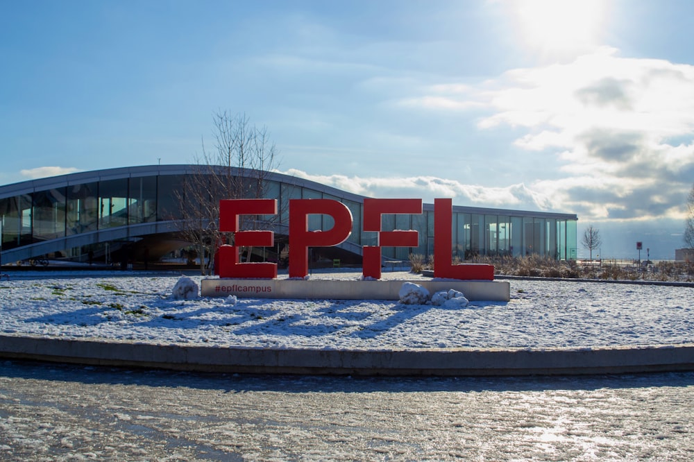 the letters epfl are displayed in front of a building