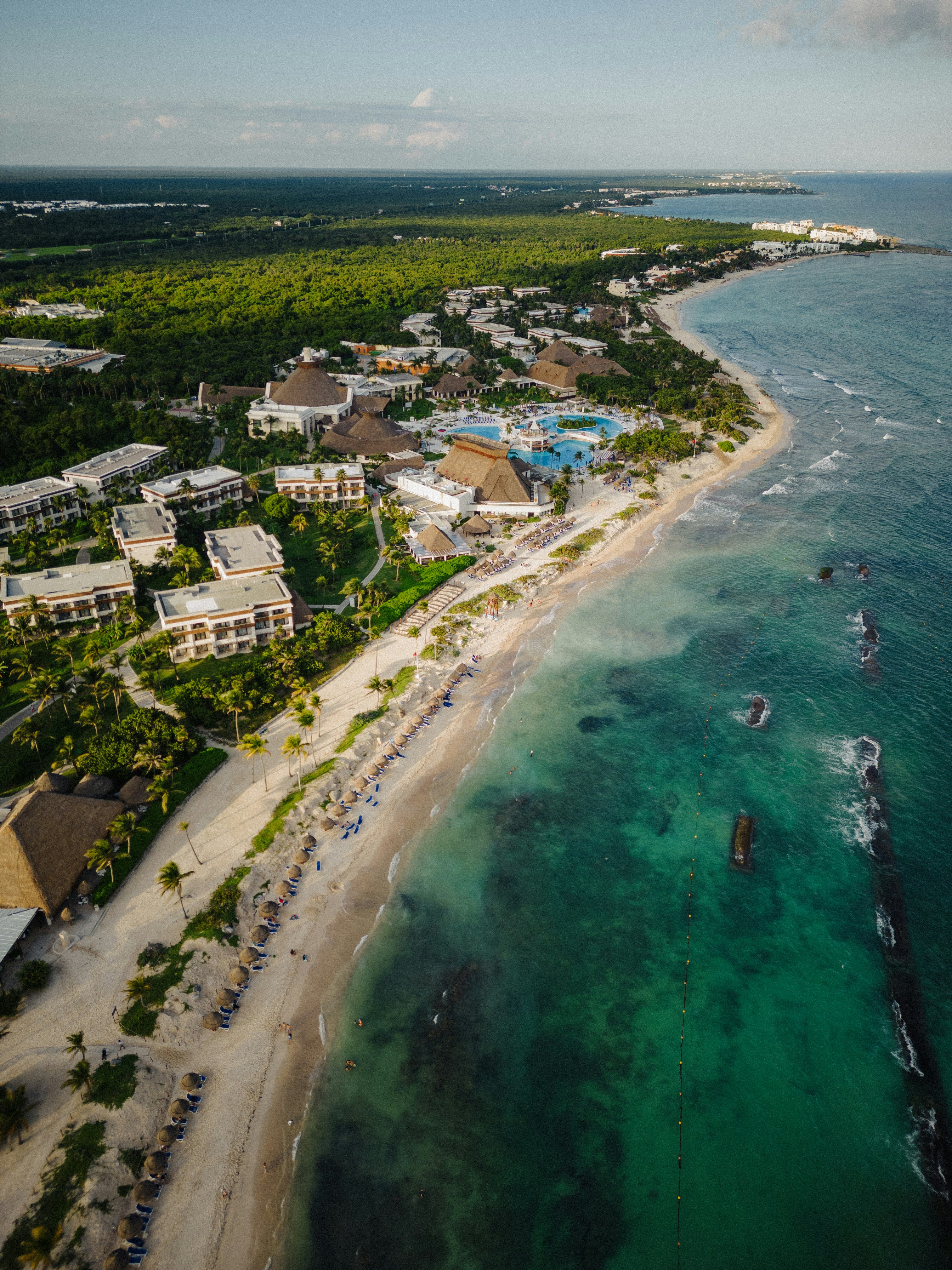 an aerial view of a resort and beach