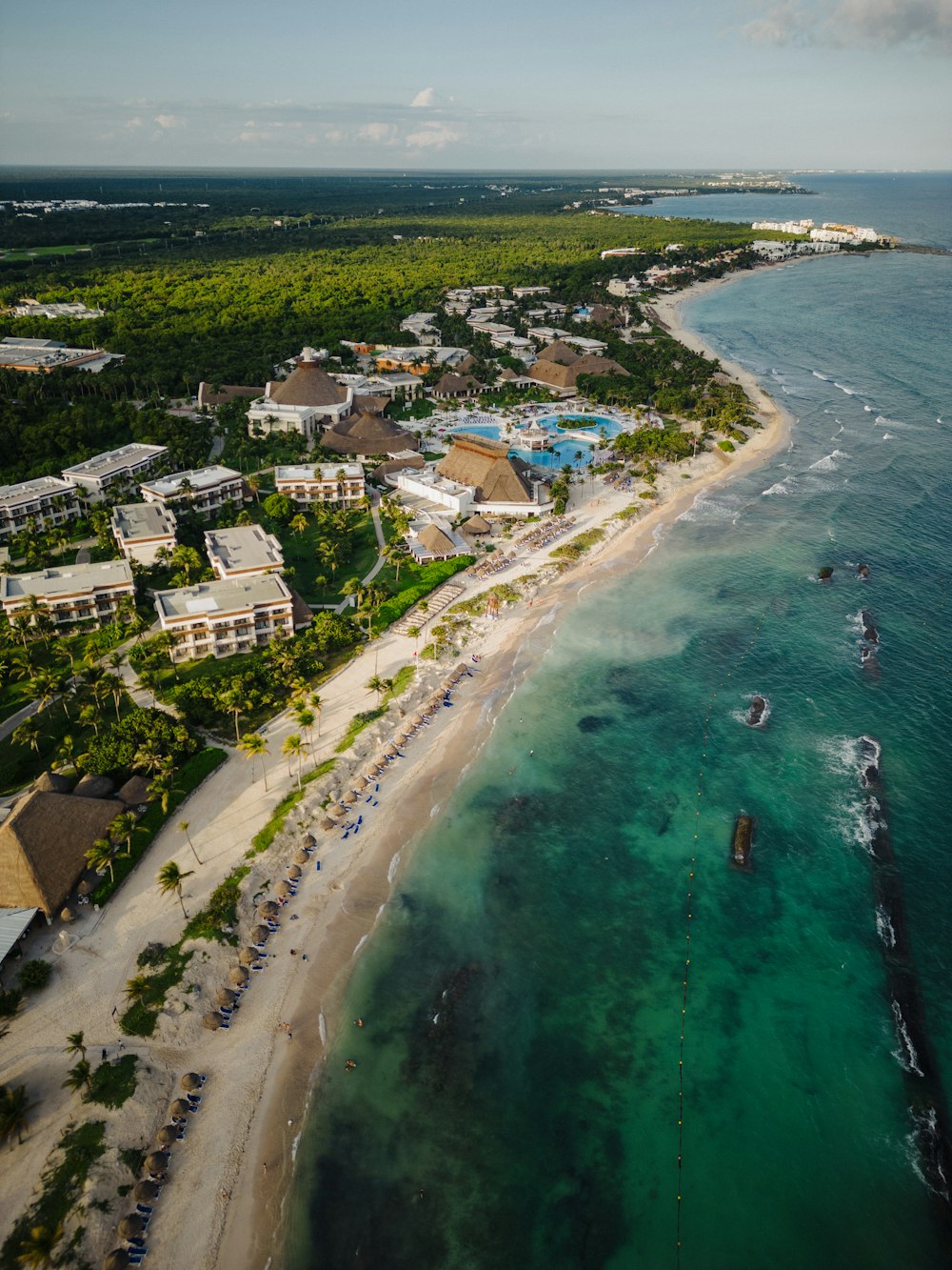an aerial view of a resort and beach