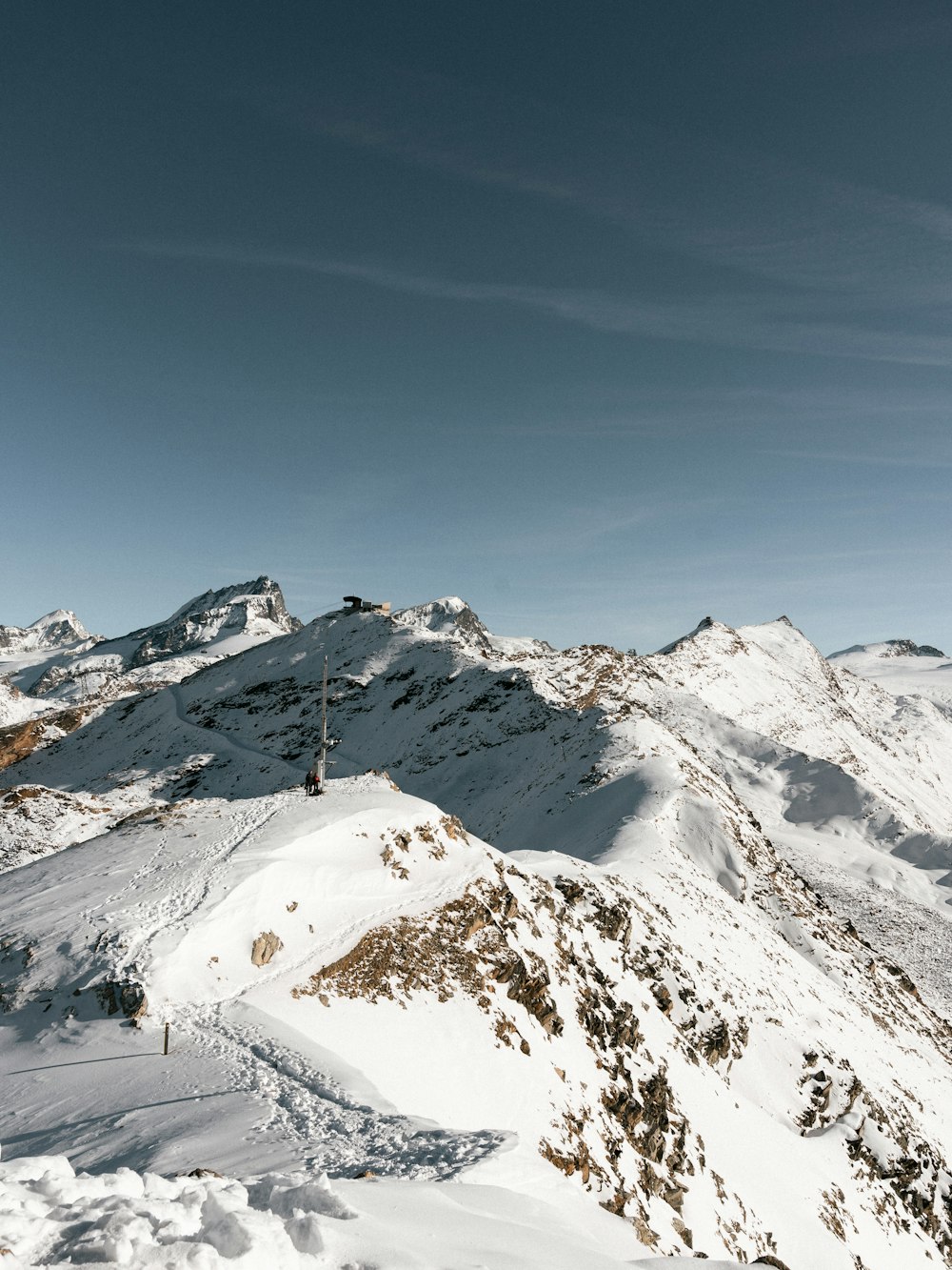 a man riding skis on top of a snow covered slope