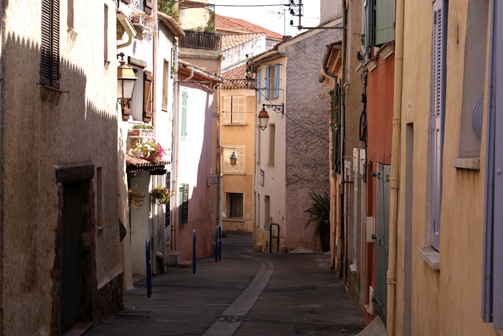 a narrow city street with buildings on both sides