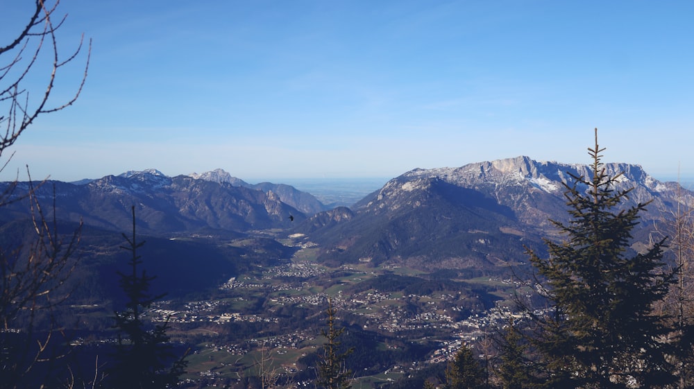 a view of the mountains from the top of a hill