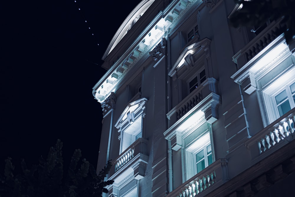 a building lit up with lights at night