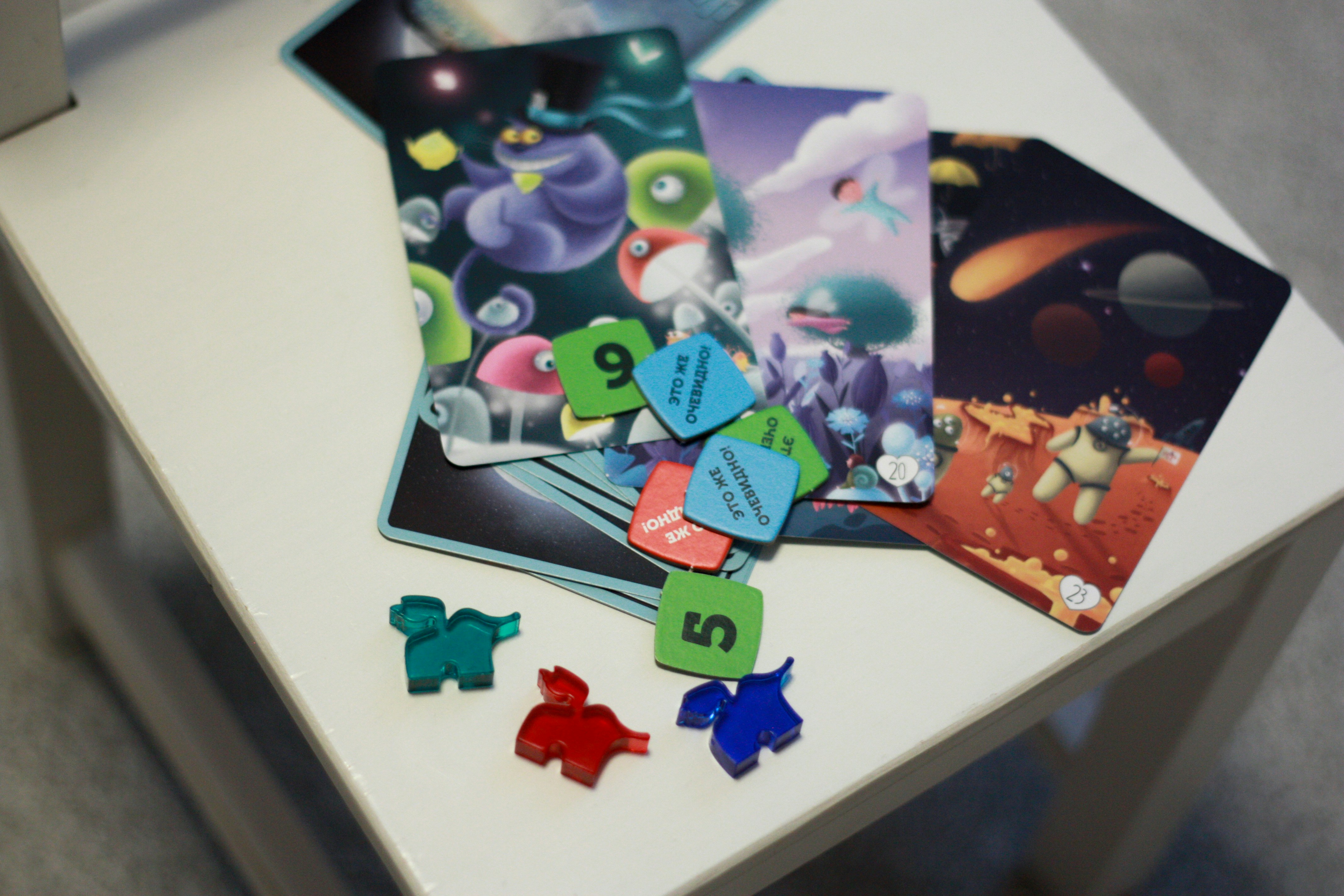 A white table covered with puzzle pieces