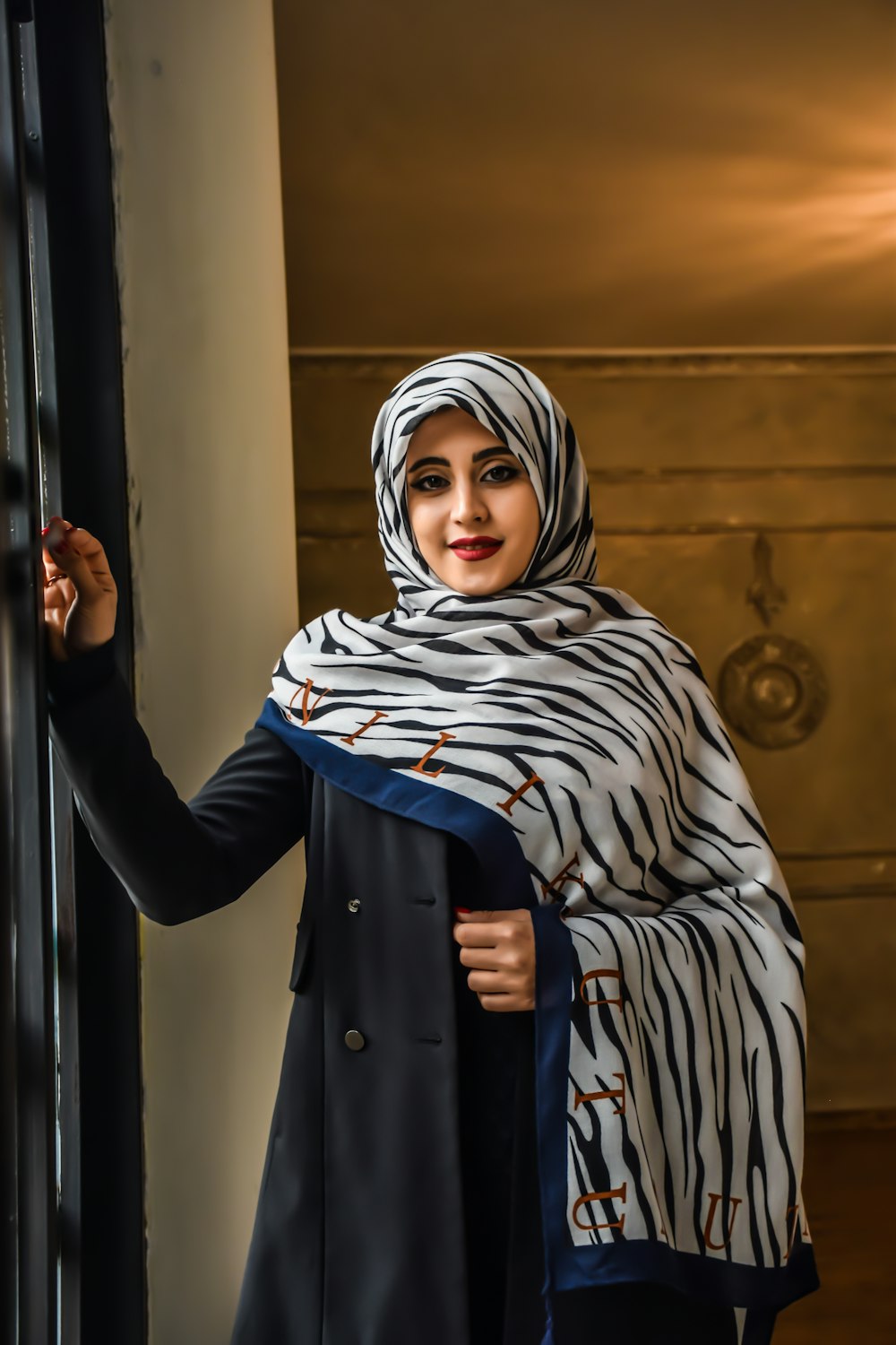 a woman wearing a zebra print shawl