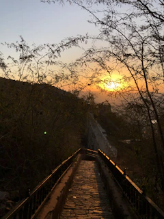 A serene sunset over a quiet path symbolizing spiritual journey