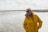 a woman standing on a beach next to the ocean