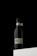 A dark bottle of Y2LA craft cider rests on a clean, white surface against a black background. The bottle features a simple label with minimalistic text and design elements.