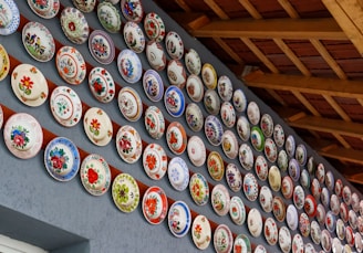 a wall covered in lots of colorful plates
