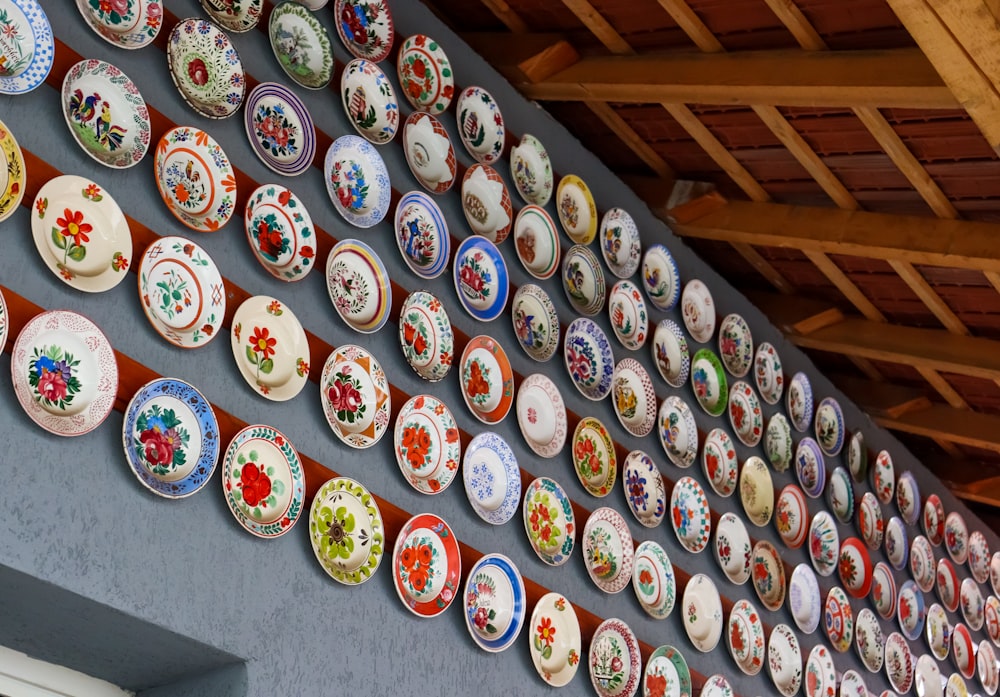 a wall covered in lots of colorful plates