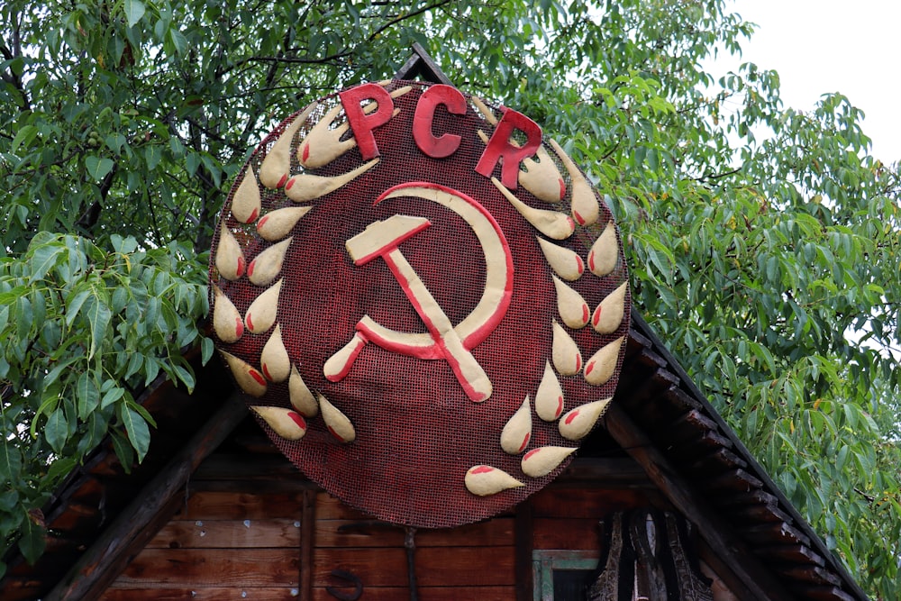 a sign on the roof of a wooden building