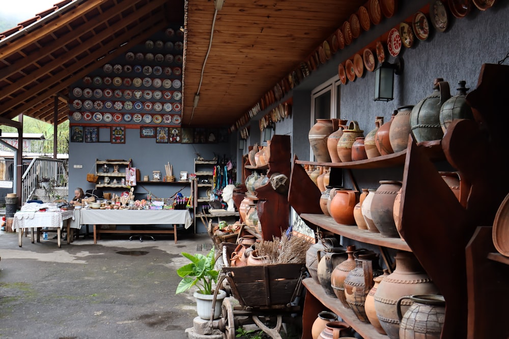 a room filled with lots of pots and vases