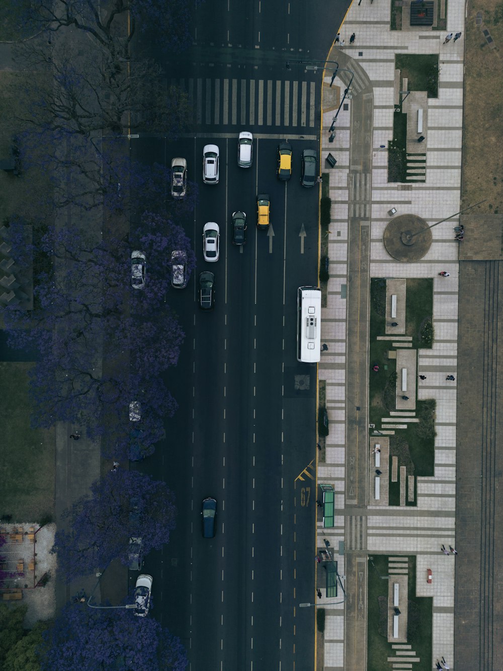 an aerial view of a city street with cars