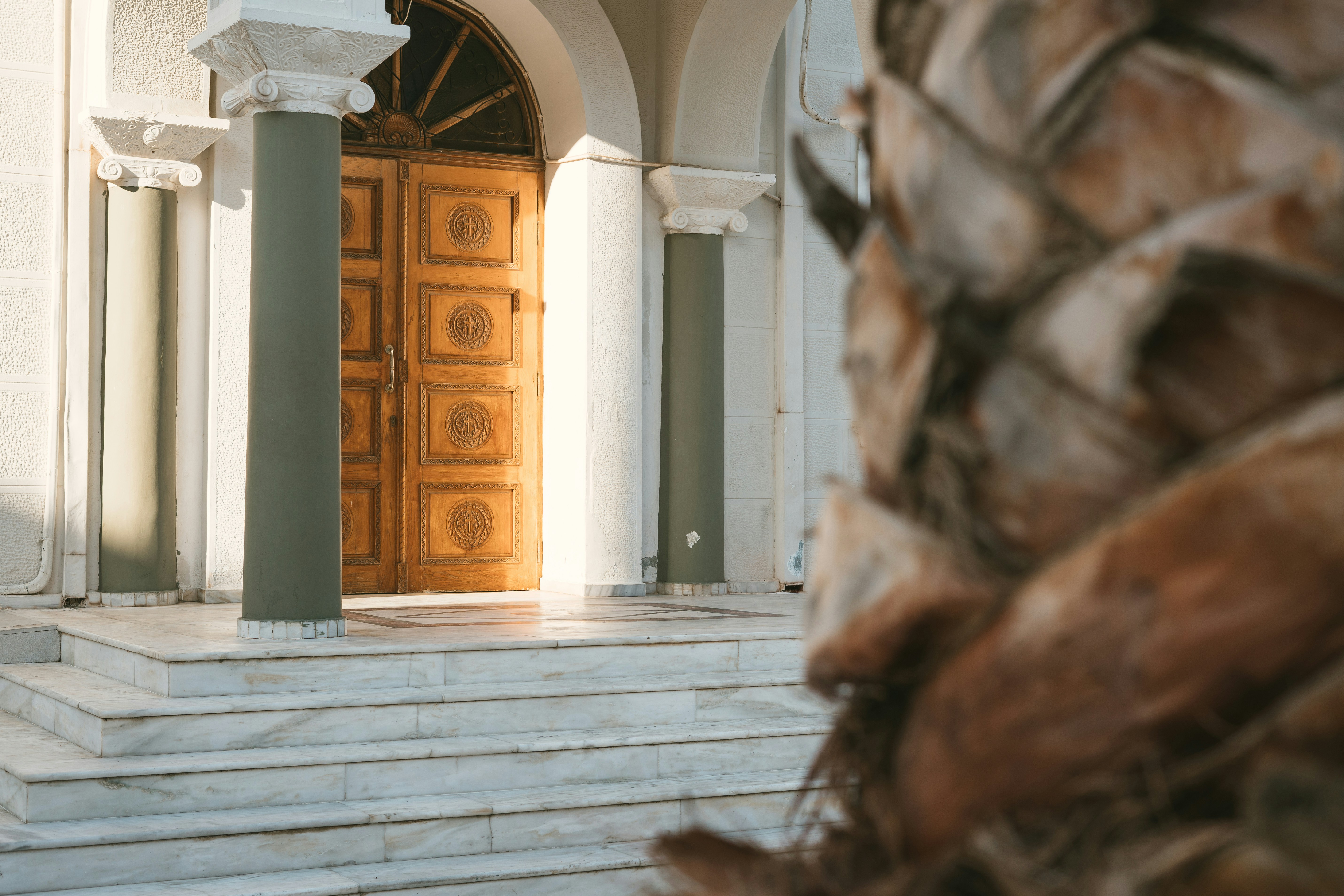 a large wooden door sitting inside of a building