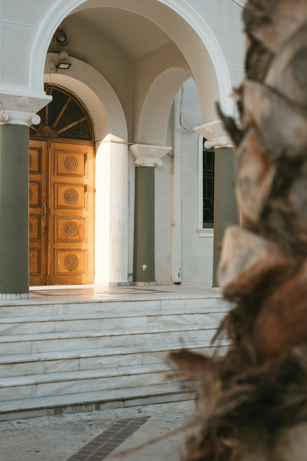 a large wooden door sitting inside of a building