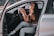 A happy customer enjoying a comfortable ride with LAX Driver.