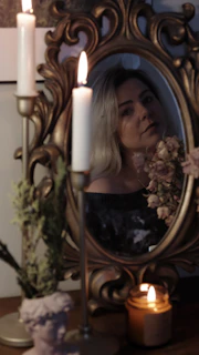 A dimly lit scene featuring elegant BDSM accessories with soft candlelight ambiance.