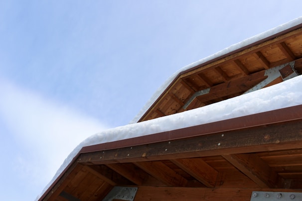 the roof of a building covered in snow