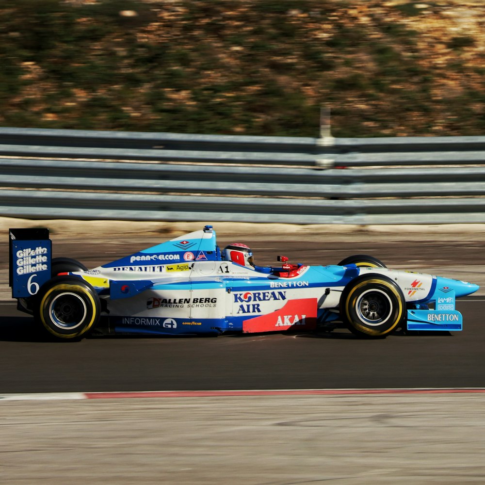 a man driving a racing car on a race track