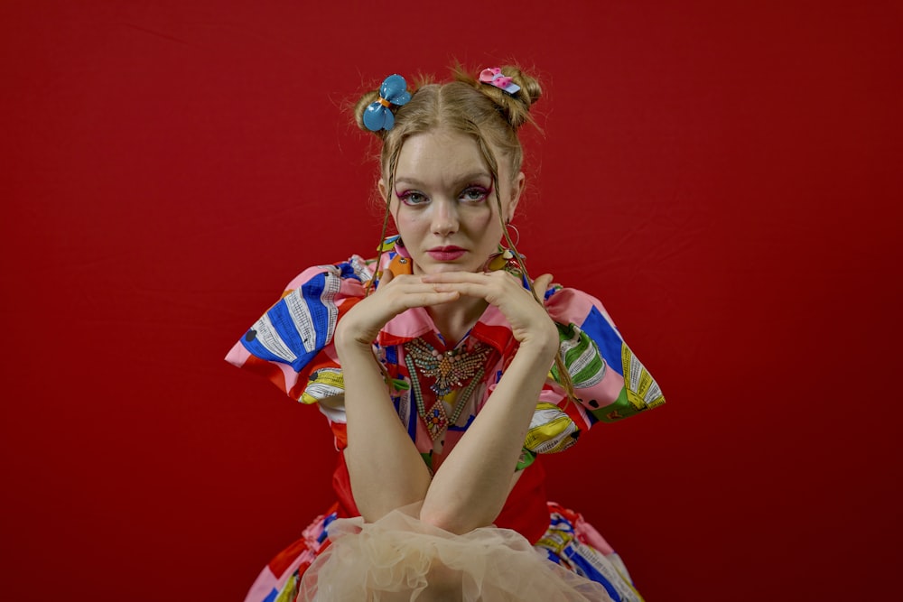 a woman in a clown costume posing for a picture