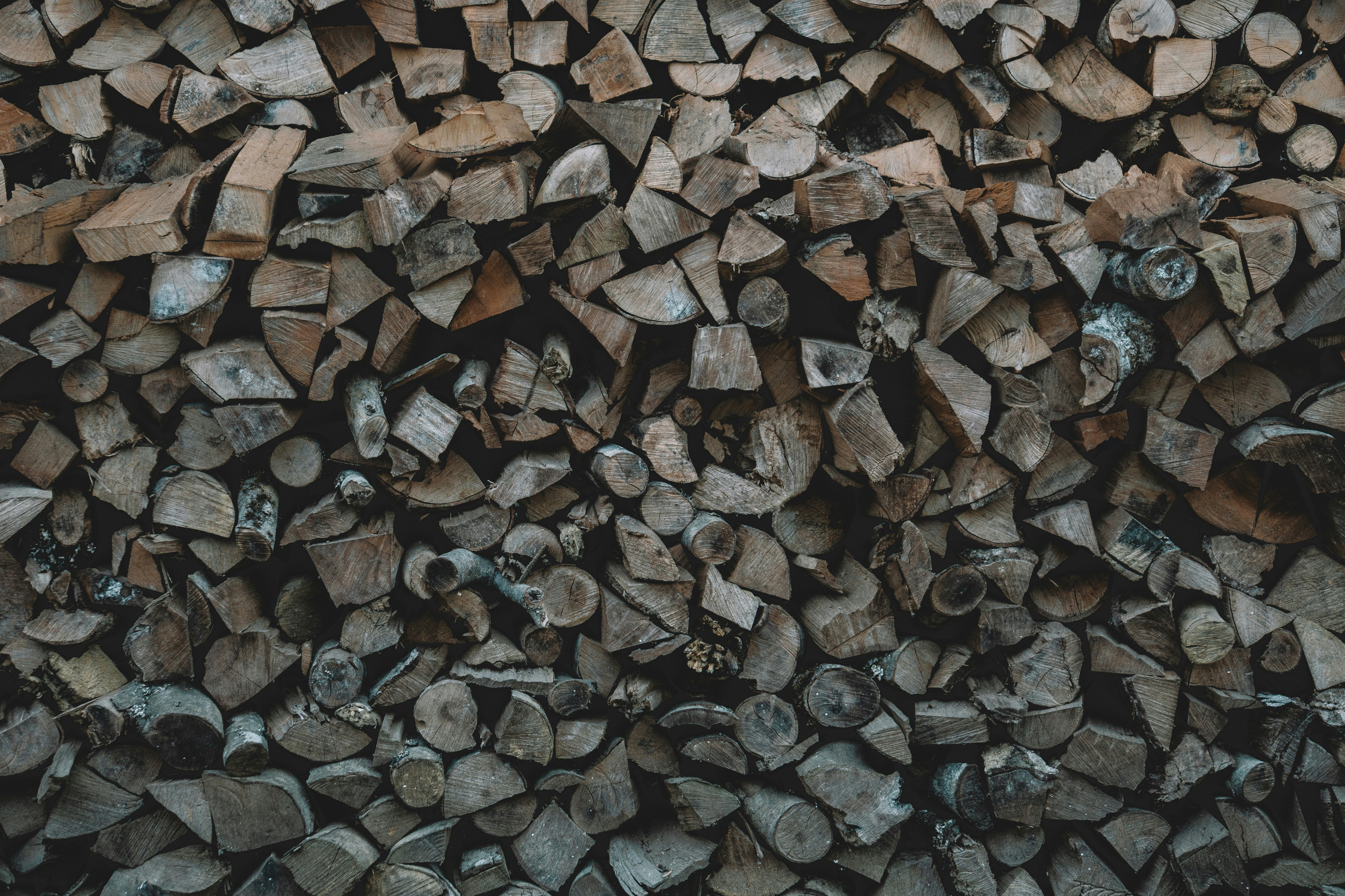 지속가능한 원자재 확보 경쟁이 시작됐다 - a pile of chopped wood sitting next to each other