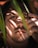 a man with long hair is looking up at the sky