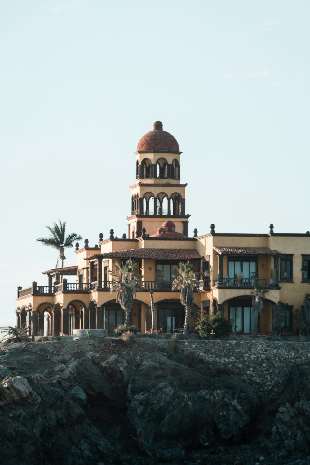 a large building on top of a rocky cliff