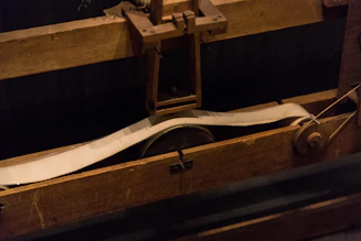 A vibrant crankie scroll unfurling against a rustic wooden backdrop, capturing the charm of folk storytelling.