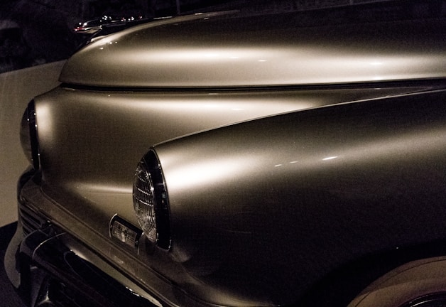 Before and after comparison of a vehicle’s exterior restoration highlighting the transformation.