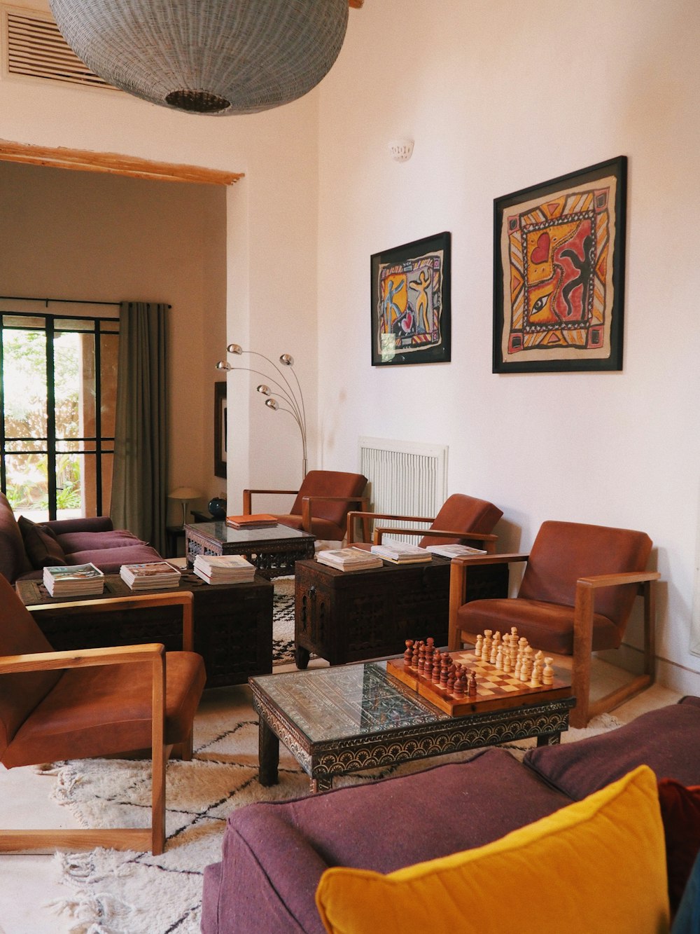 a living room filled with furniture and a chess board