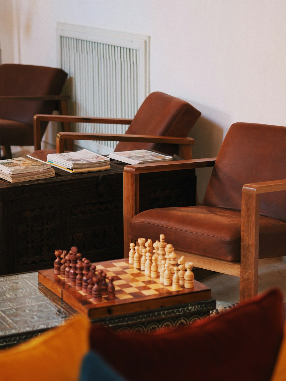 a living room filled with furniture and a chess board